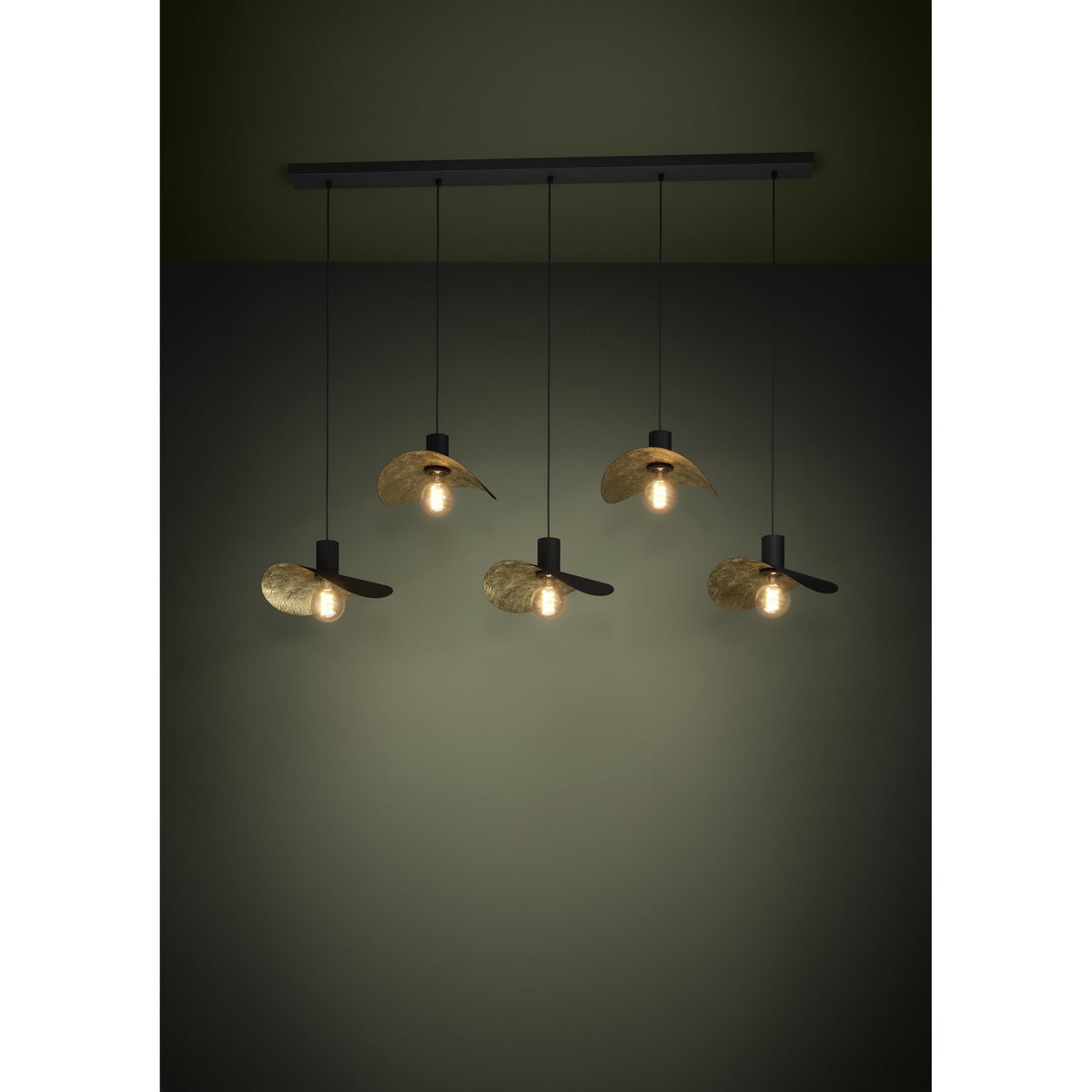 Saceda Linear Pendant Light in black and gold, with five hat-shaped steel shades at staggered heights along a black ceiling bar, each shade's gold-lined underside catching the bulb glow.