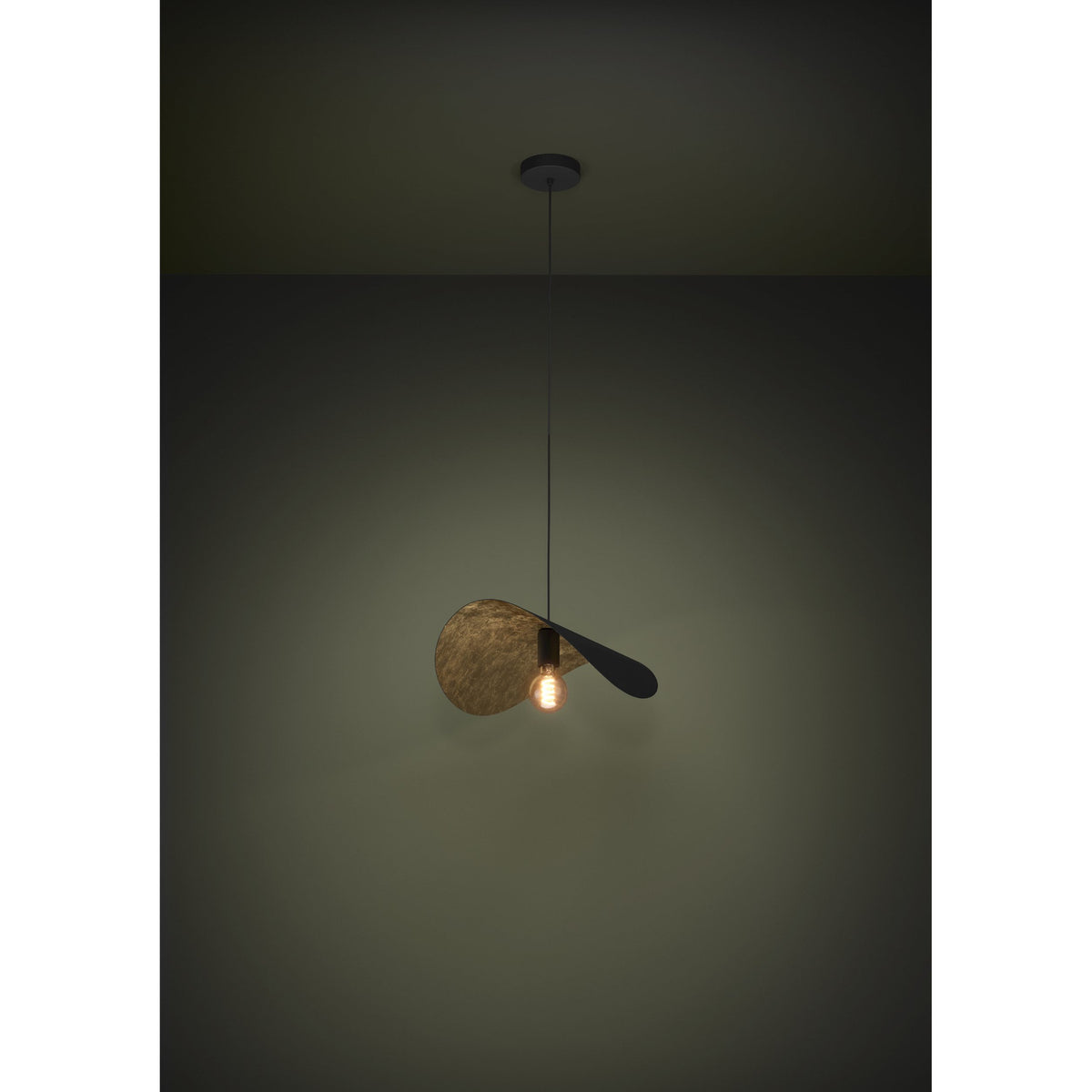 Saceda Pendant Light 53cm in Black & Gold, a single-light fixture with a curved steel disc shade, matt black outside and textured gold inside, suspended on a thin black cord against a dark background.