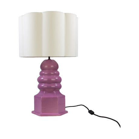Safi ceramic table lamp with a glossy Carnation Pink stacked, tiered base on a six-sided plinth, topped by a scalloped cream fabric drum shade, shown on a plain white background.