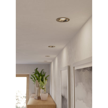 Salabate LED Downlight in satin nickel recessed into a hallway ceiling, shown alongside further downlights, artwork and a plant-topped sideboard.
