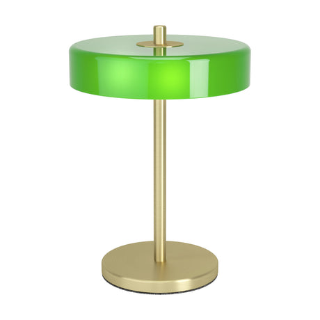 Salve Table Lamp in brushed brass with a slim stem, round base, and wide glossy green opal glass disc shade, shown on a plain white background.