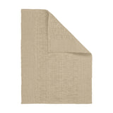 Sanchore Placemat in speckled beige woven cotton, folded diagonally to show a ribbed border and textured basket-weave centre, on a plain white background.
