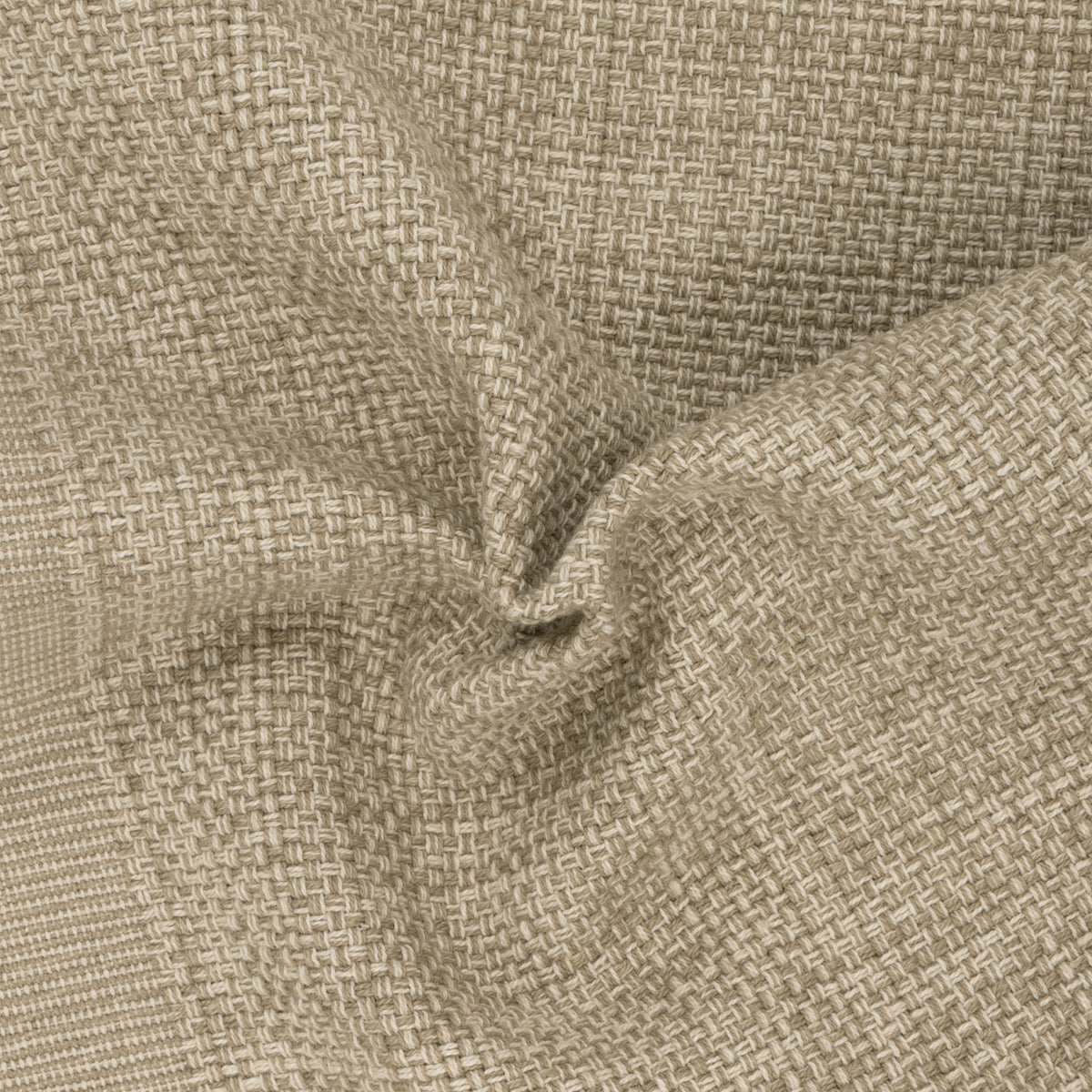Sanchore Placemat in beige, close-up of the woven cotton fabric gathered to show its textured basket-weave pattern and speckled natural tones.
