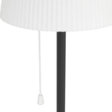 Close-up of the Scordiano-L solar LED floor lamp showing the slim black steel pole, white pull cord, and pleated white plastic shade against a plain white background.