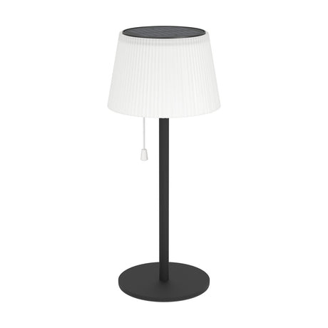 Scordiano Solar LED Table Lamp in black, featuring a slim steel stem, round base, white pleated plastic shade with top-mounted solar panel, and pull-cord switch, shown on a plain white background.
