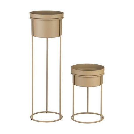 Selangor Metal Plant Stand Set of 2 in sand, featuring tall and short round metal planters with deep bowls on slim ring-base legs, shown on a plain white background.