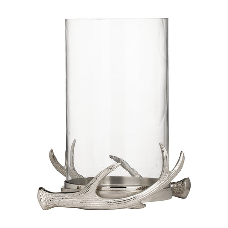 Selising Candle Holder 26cm in nickel, a clear glass hurricane set on a cast aluminium antler base with textured, polished nickel tines, shown on a plain white background.
