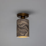Senna Ceramic Ceiling Light in marbled grey and cream, slim cylindrical shade beneath a round brass canopy, open base with visible E27 bulb, shown against a plain light grey background.