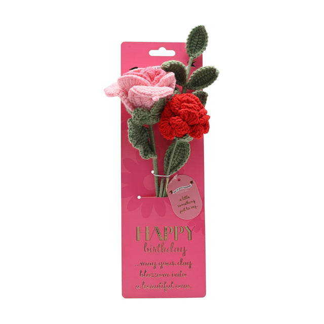 Happy Birthday Crochet Roses Flower Bundle featuring a pale pink and a red crocheted rose with sage green stems and leaves, mounted on a hot pink printed card.