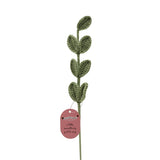 Single Stem Crochet Leaves Ornament, 39cm, with seven textured green crocheted leaves climbing a slim stem, a pink gift tag attached, set against a plain white background.