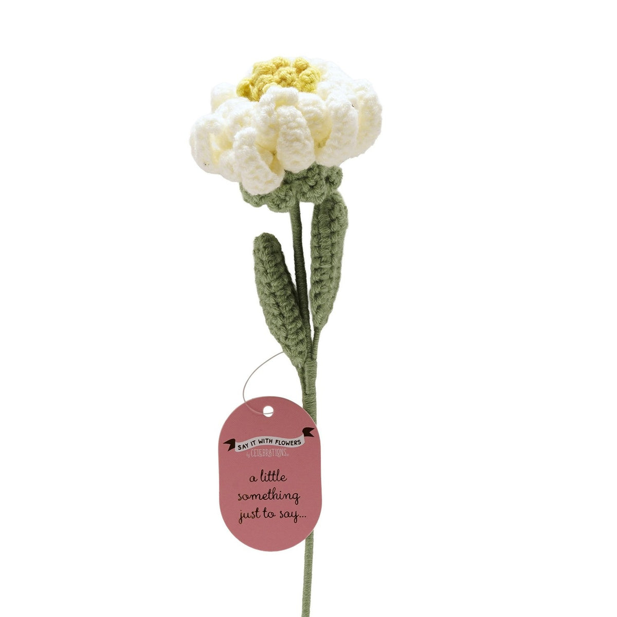 Single stem crochet peony ornament, 35cm, with curled white petals, yellow centre, green cup and two leaves on a slender stem, "Say It With Flowers" gift tag attached, plain white background.