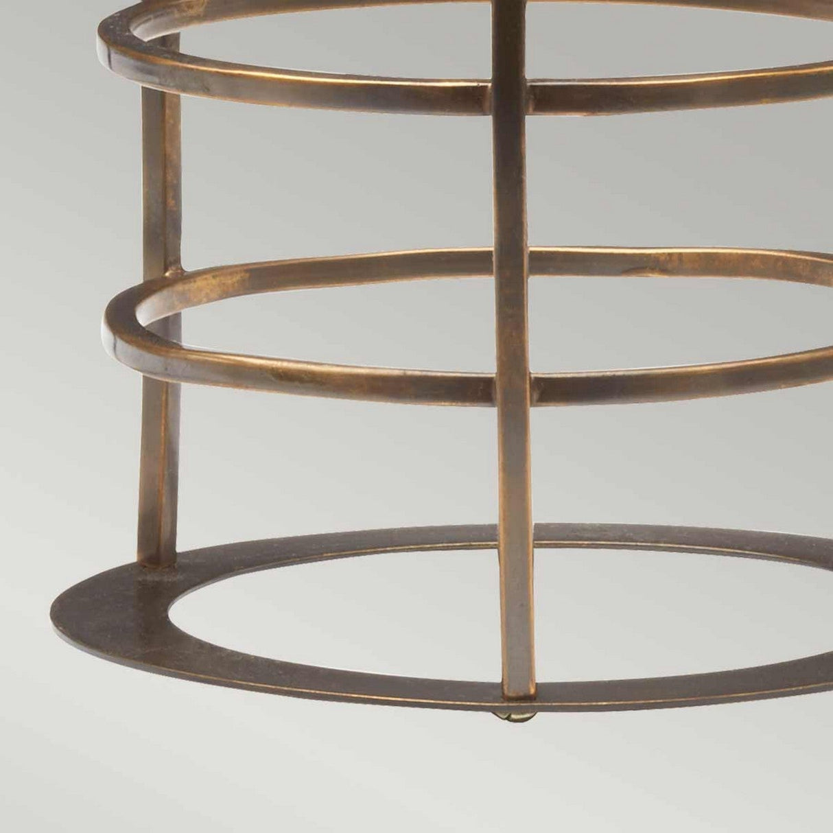 Close-up of the Cage Accessory from the Sheldon & Somerton collection, featuring circular rings and vertical supports in a brass finish, set against a light gray background. Perfect as a lantern accessory.