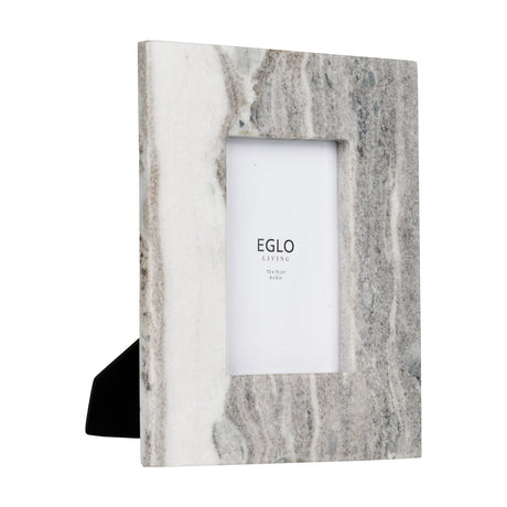 Siayan Photo Frame, a portrait-style picture frame in natural marble with grey and white veining, holding a 4x6in print, shown with a rear stand on a white background.