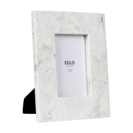Siayan Photo Frame, a rectangular white marble frame with soft grey veining, broad border, and rear stand, holding a 10x15cm photo on a plain background.