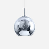 This Grand Ball Glass Pendant 25cm in Silver is a contemporary lighting element, showcased against a simple white backdrop. Its spherical design and lustrous surface produce a mirrored effect, gently reflecting the environment. The pendant light is compatible with LED bulbs, prioritizing energy efficiency while maintaining its stylish appeal.