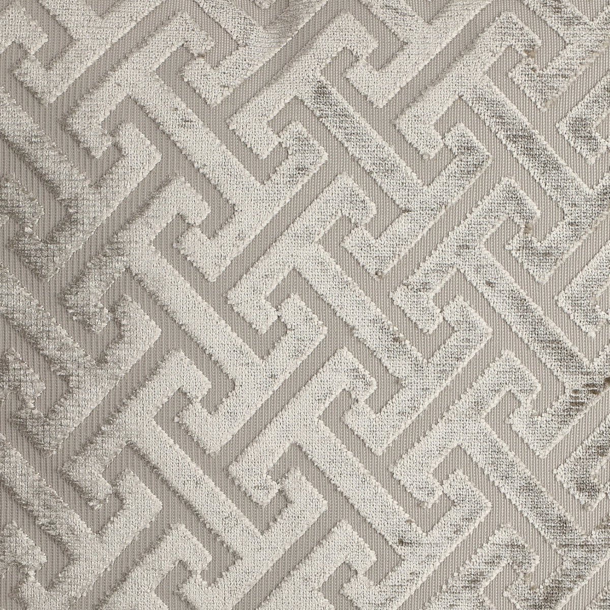 Singu Cushion in beige, square shape with a raised geometric fret pattern in velvety pile against a flatter woven ground, shown in close-up detail.