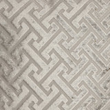Singu Cushion in beige, square shape with a raised geometric fret pattern in velvety pile against a flatter woven ground, shown in close-up detail.