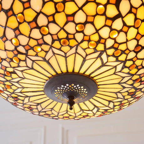 Ravenstead 3 light Tiffany inverted pendant with 450mm leaded glass bowl in amber and cream tones on a bronzed metal fitting, shown from below.