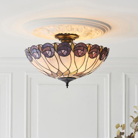Pentleigh 3 Light Tiffany semi flush ceiling light with multicoloured leaded glass shade and bronze fitting, mounted on a white ceiling above panelling.
