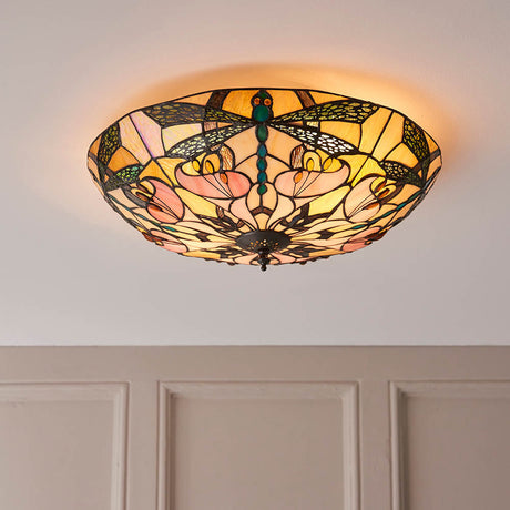 Wrenfield Large 2 Light Tiffany flush ceiling light with 450mm multicoloured leaded glass shade featuring a dragonfly motif, fitted to a white ceiling.