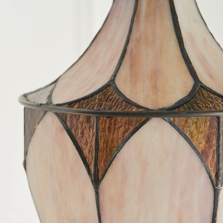 Close-up of the Tiffany Marlgrove Medium Acorn pendant shade, showing leaded multicoloured glass panels in cream and amber tapering along a slim metal frame.