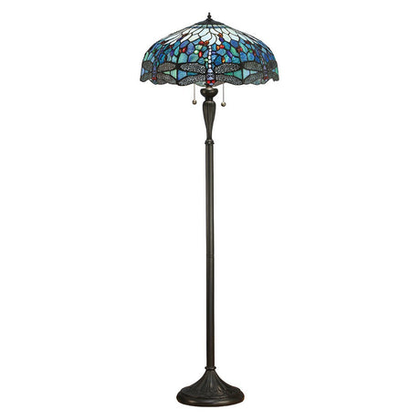Alderworth Tiffany floor lamp with dragonfly-motif leaded blue glass shade on a dark metal column and cast base, shown on a white background.