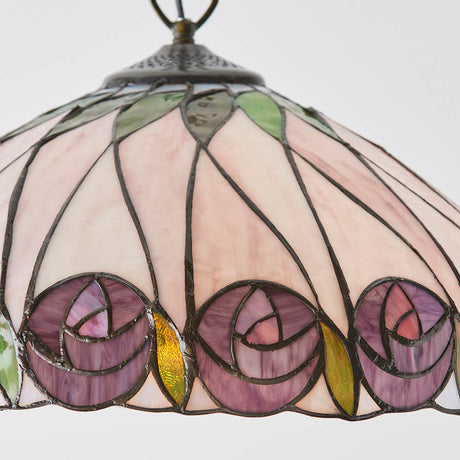 Pentleigh Medium Tiffany pendant light with 400mm leaded glass shade in pink, purple rose motifs, green leaves, and antique brass suspension.