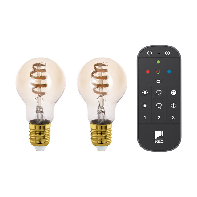 Two Smart LED GLS bulbs, E27 brass screw cap, amber glass with spiral filament, shown with a black CCT remote control on a white background.