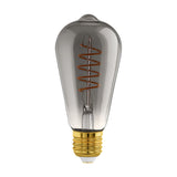 Smoked LED vintage ST64 bulb with a spiral filament inside a tapered glass body and brass-coloured E27 screw cap, shown on a plain white background.