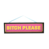 Rectangular wooden hanging plaque with black frame and gold inner edge, reading "BITCH PLEASE" in bold yellow capitals on a hot pink panel, with pale blue ribbon hanger, on a white background.