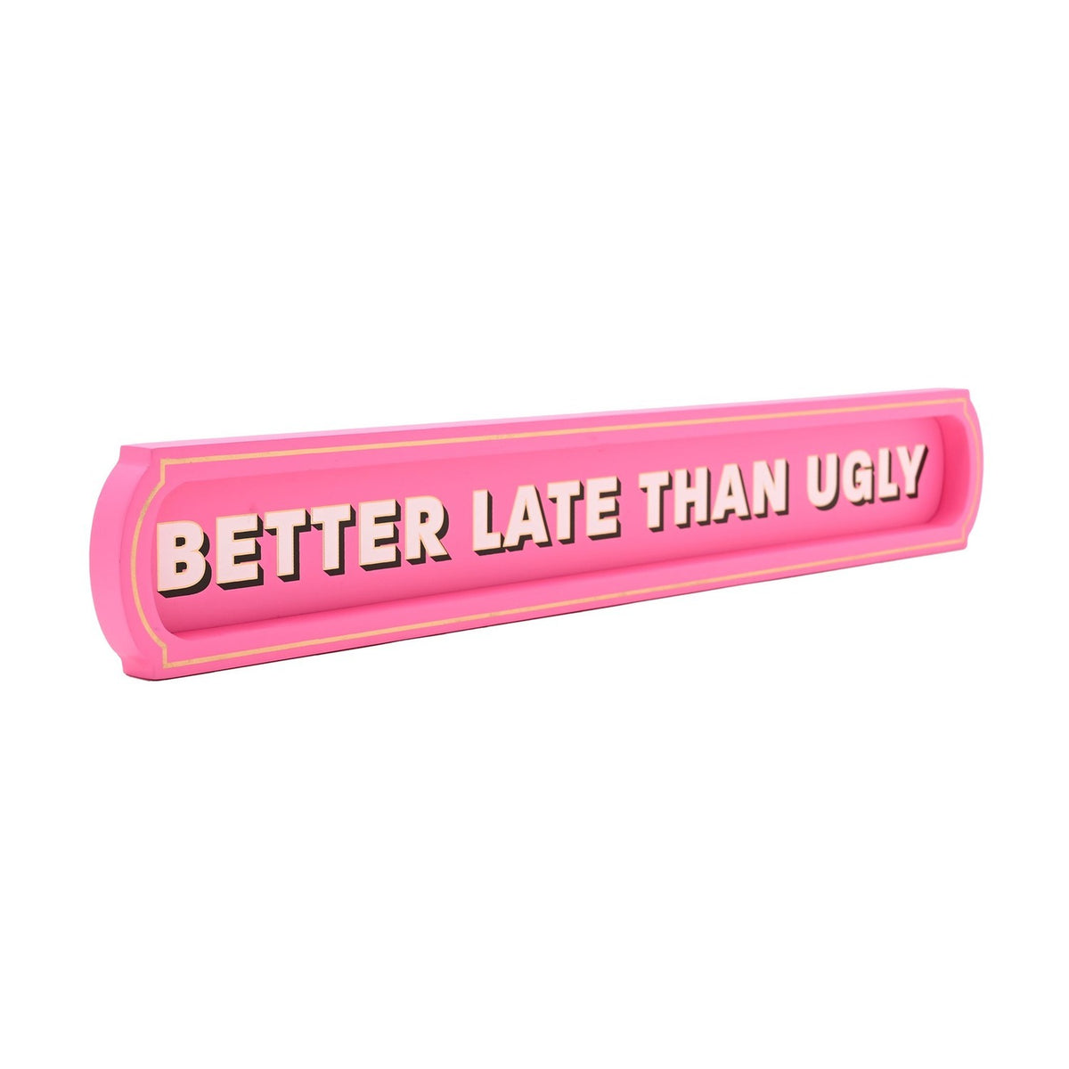 Pink wooden wall plaque with recessed centre panel and gold trim, reading "Better Late Than Ugly" in bold pale pink capitals, shown on a white background.