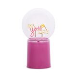 Be You Tiful Globe LED Neon Ceramic Table Lamp, 22cm pink base with clear round globe displaying "BE you TIFUL" lettering and heart detail on slim stems, plain white background.