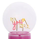 Be You Tiful Globe LED Neon Ceramic Table Lamp 22cm in pink, with "BE you TIFUL" lettering and a yellow heart floating inside a clear round globe on a pink base, shown on a white background.