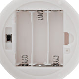 Interior battery compartment of the Be You Tiful Globe LED Neon Ceramic Table Lamp, showing three slots with coiled metal springs, metal contacts, and an ON/OFF slide switch.