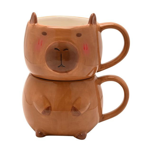 Capybara Head and Body Stacking Earthenware Mug in glazed brown ceramic, head mug with ears and blushed cheeks atop a rounded body mug with paws, on a white background.