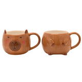 Capybara Head and Body Stacking Earthenware Mug in glazed brown ceramic, shown as two separate mugs with a face design and paw details, on a white background.