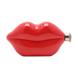 Red steel hip flask shaped like glossy pouting lips, 5oz capacity, with a knurled silver screw cap at one corner, shown on a plain white background.
