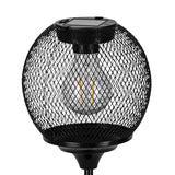 Solar LED table lamp with a round black wire-mesh globe on a slim stem, showing an integrated filament-style LED bulb and a small solar panel on top, set against a plain white background.