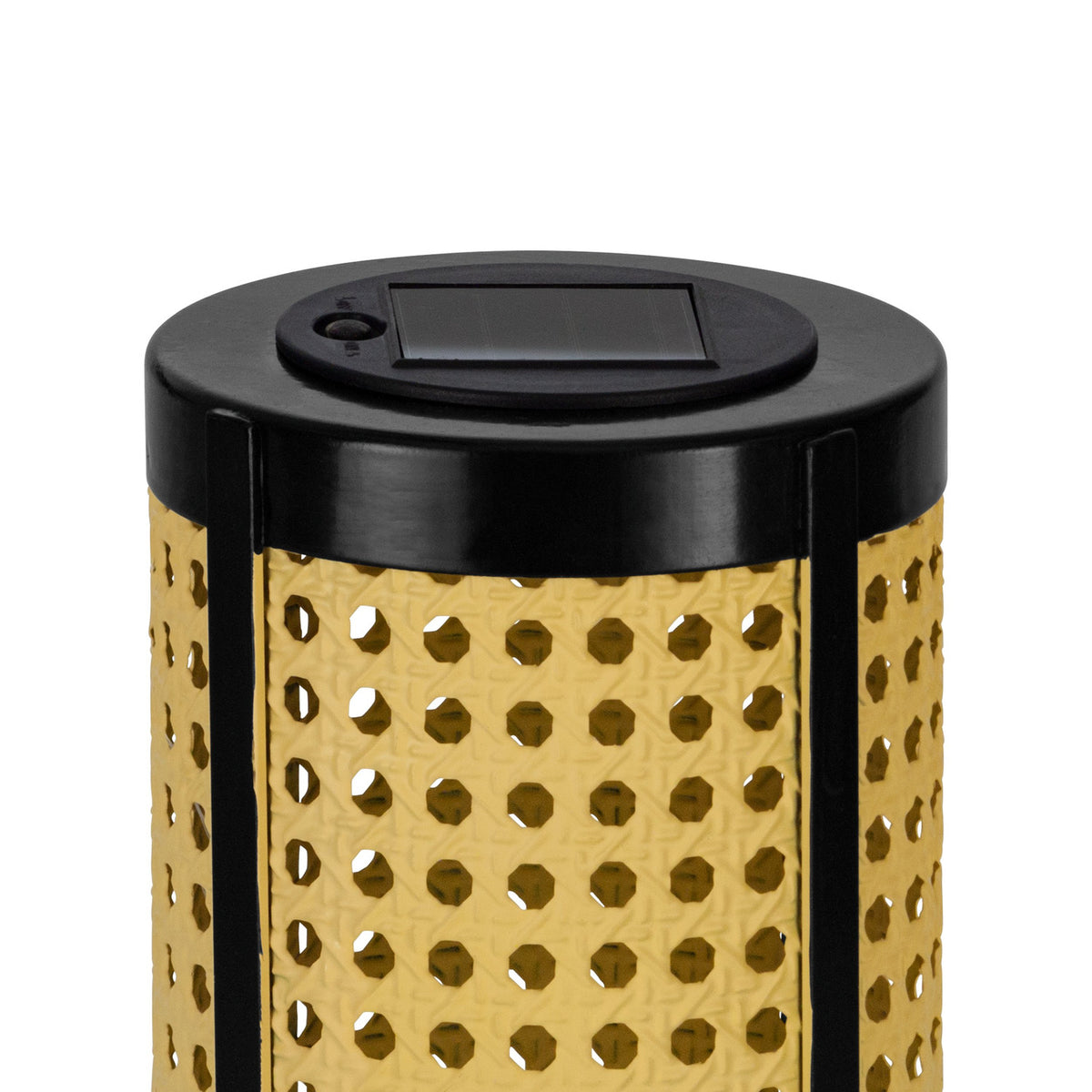 Close-up of the Solar LED Table Lamp's black top with integrated solar panel, above a cylindrical shade with cane-style pierced pattern in beige, set on a plain white background.