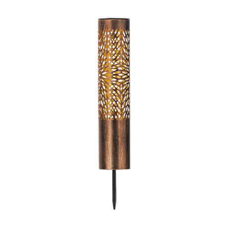 Solar spike light with a slim bronze steel cylinder, black top and ground spike, cut in a floral pattern revealing a gold inner surface, shown on a plain white background.