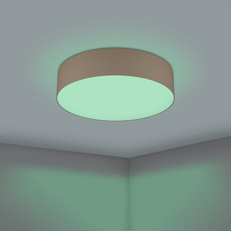 Somorne Smart LED Flush Ceiling Light with round taupe fabric drum shade and white diffuser, mounted on a grey ceiling casting a soft green glow.