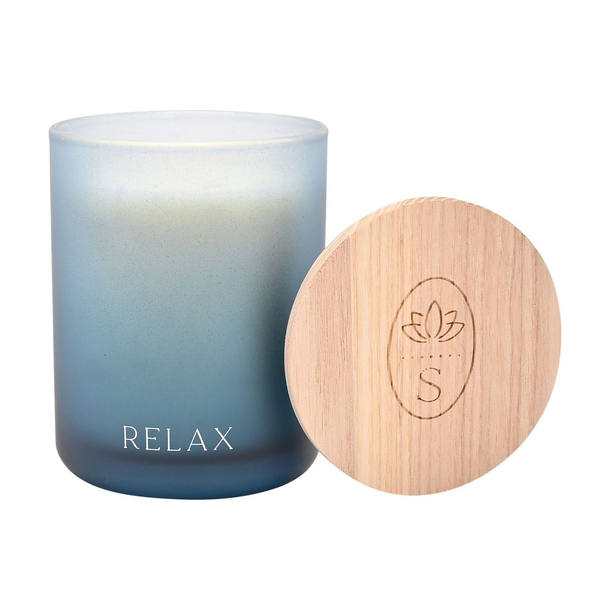 Round frosted glass scented candle in blue ombre finish with "RELAX" printed near the base, paired with a wooden lid featuring a lotus logo, on a plain white background.