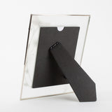 Rear view of the Classic Dragonfly Glass & Wire Photo Frame 6x4in in silver, showing the black easel stand and backing against a plain white background.
