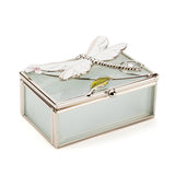 Rectangular frosted glass trinket box with a silver-toned frame, featuring a white enamel dragonfly, green leaf, and pink flower on the lid, shown on a plain white background.