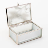 Rectangular glass trinket box with frosted panels and a slim silver-toned frame, shown open on a white background to reveal the mirrored lid and interior.