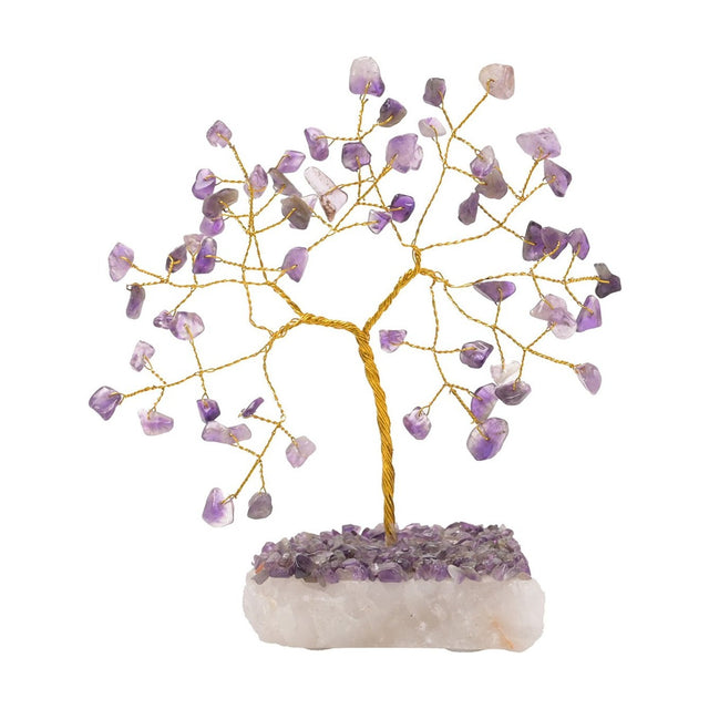 Amethyst gemstone tree ornament with a twisted gold-coloured wire trunk and branches tipped with purple amethyst chips, set on a chunky white crystal base against a plain background.