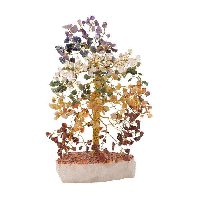 Large multi-coloured gemstone tree ornament with gold-coloured wire branches holding chip stones in bands from purple and blue to green, yellow and red-brown, set on a white stone base.