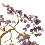 Close-up of the Amethyst Gemstone Tree Ornament, showing twisted gold wire branches holding glazed purple amethyst chips in varying shades, against a plain white background.