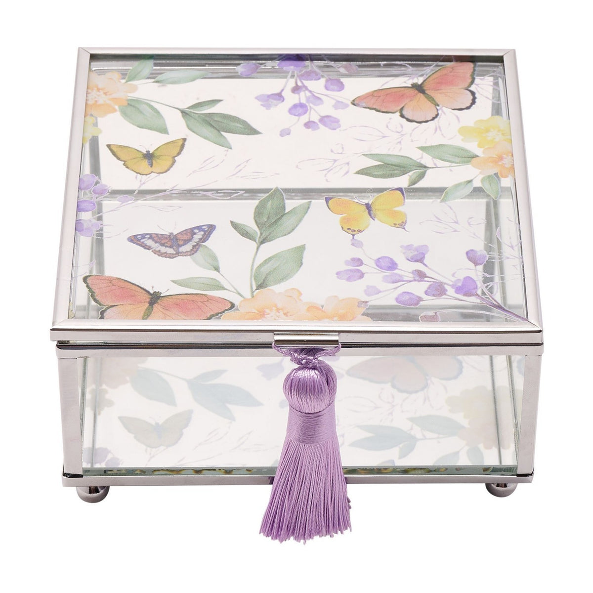 Square glass trinket box with silver-tone frame, clear glass sides, butterfly and purple floral lid design, and a purple tassel pull, shown on a white background.