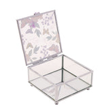 Square glass trinket box with open hinged lid showing a butterfly and floral print, clear glass walls, mirrored base, and silver-tone frame on a white background.